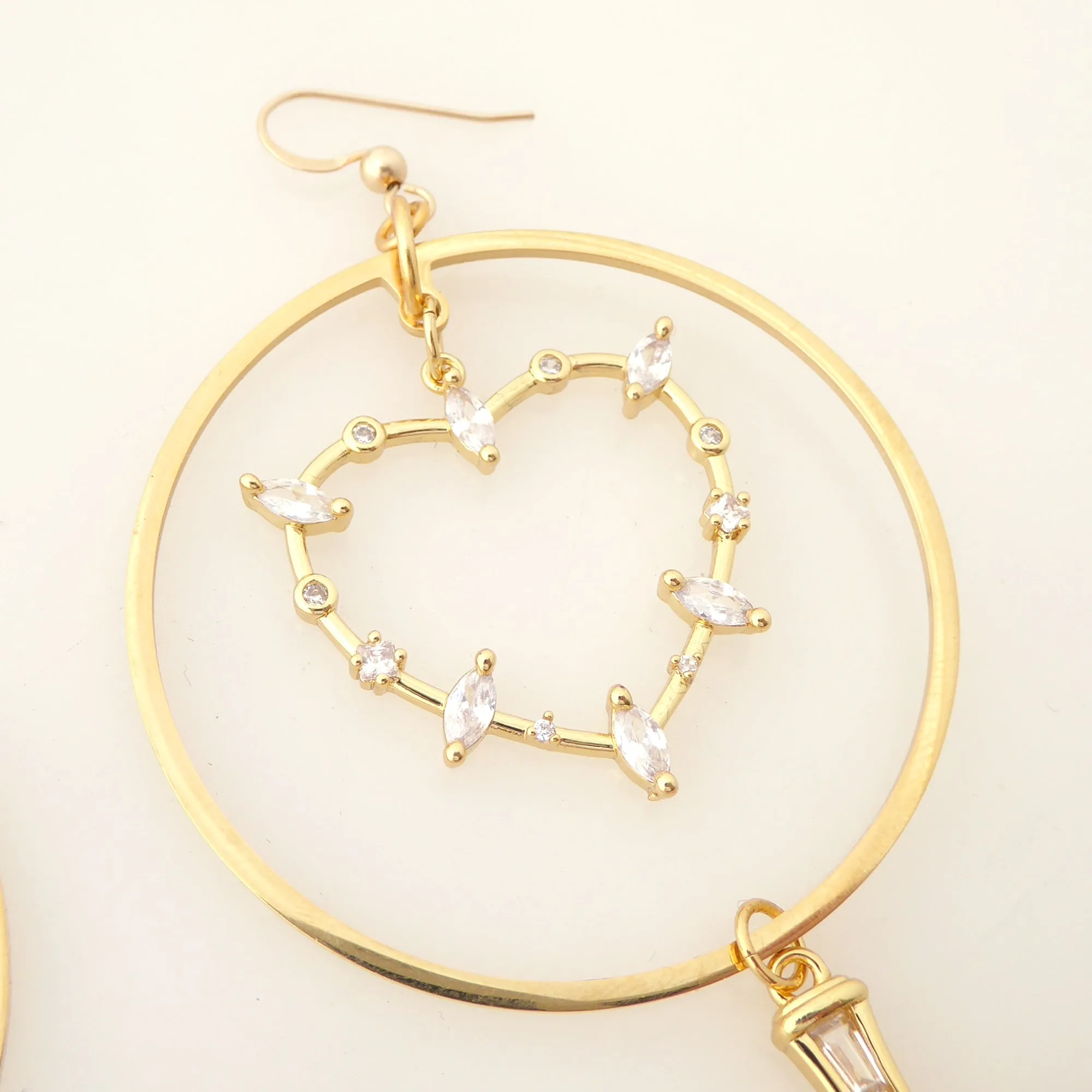 Gold rhinestone heart and dagger earrings