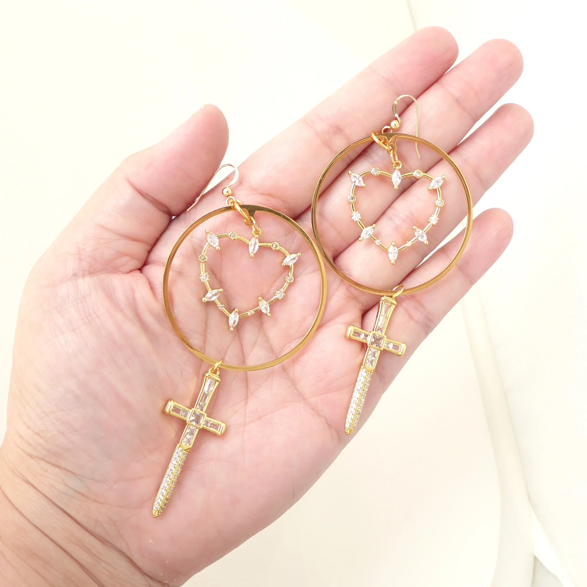 Gold rhinestone heart and dagger earrings